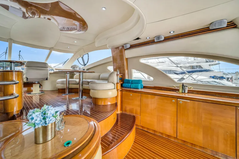  Yacht Photos Pics Luxurious interior of 2006 Azimut FLY 55 yacht with elegant wood finishes and seating.