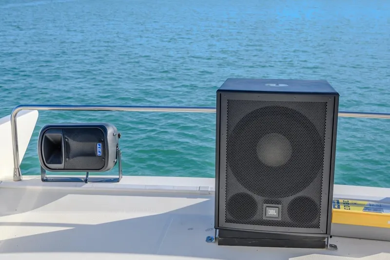  Yacht Photos Pics Speakers on Azimut FLY 55 yacht deck, 2006 model, with ocean backdrop.
