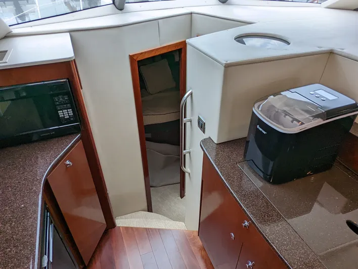 Lady C Yacht Photos Pics Interior of 2011 Meridian 341 Sedan yacht with kitchen and cabin entrance.