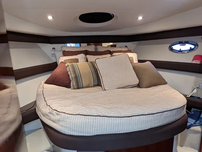 Lady C Yacht Photos Pics 2011 Meridian 341 Sedan interior cabin with cozy bed and decorative pillows.