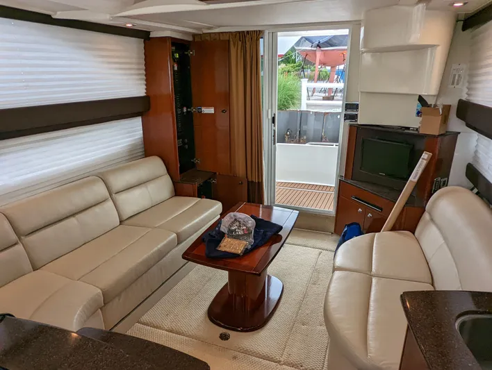 Lady C Yacht Photos Pics Interior of 2011 Meridian 341 Sedan yacht with beige leather seating and wooden accents.