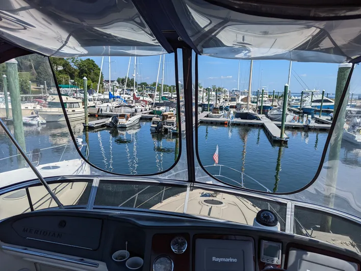 Lady C Yacht Photos Pics View from 2011 Meridian 341 Sedan yacht cockpit overlooking marina with boats and clear sky.