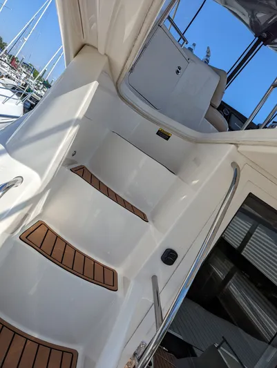 Lady C Yacht Photos Pics Staircase on a 2011 Meridian 341 Sedan yacht, featuring teak steps and stainless steel railings.
