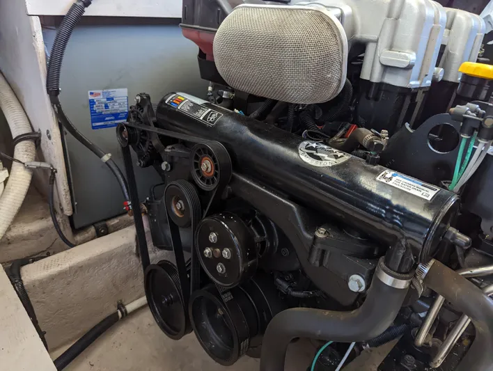 Lady C Yacht Photos Pics Engine compartment of a 2011 Meridian 341 Sedan boat, showcasing mechanical components.