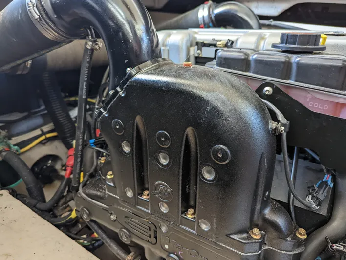 Lady C Yacht Photos Pics Engine compartment of a 2011 Meridian 341 Sedan boat, showcasing detailed components.