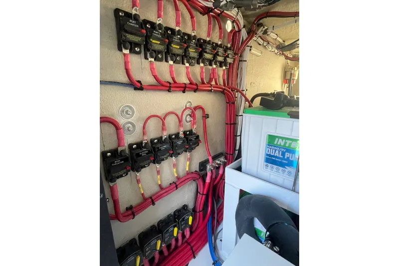 Madnic Yacht Photos Pics Electrical panel with red wiring and marine battery in a Jupiter 43, 2025 model.