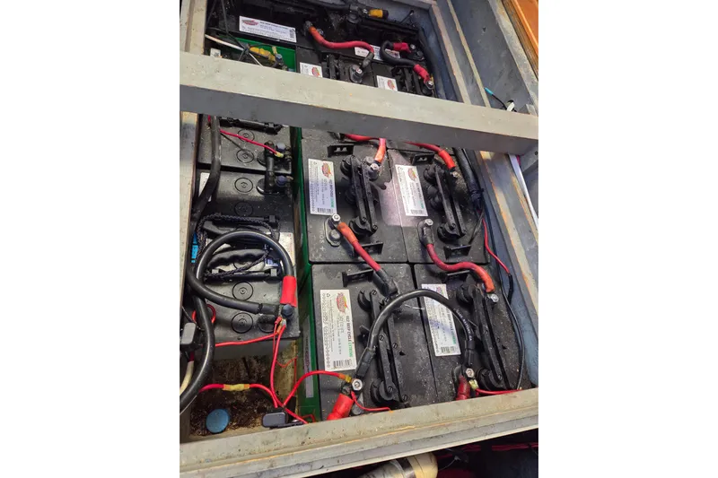 Pemaquid Yacht Photos Pics Battery compartment of a 1998 Oyster 485 Deck Saloon yacht, showing multiple connected batteries.