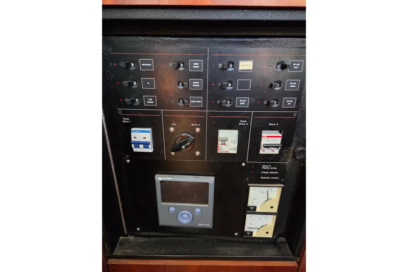 Pemaquid Yacht Photos Pics Control panel of a 1998 Oyster 485 Deck Saloon yacht with switches and meters.