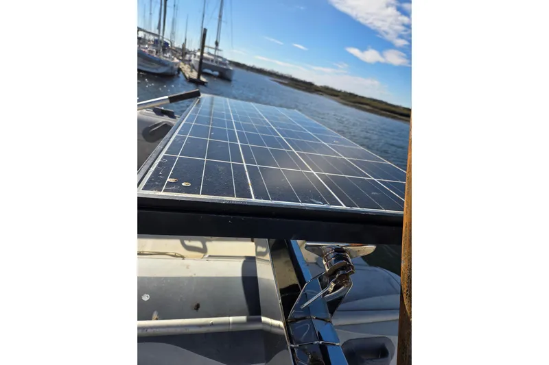 Pemaquid Yacht Photos Pics Solar panel on 1998 Oyster 485 Deck Saloon yacht, docked with clear sky background.