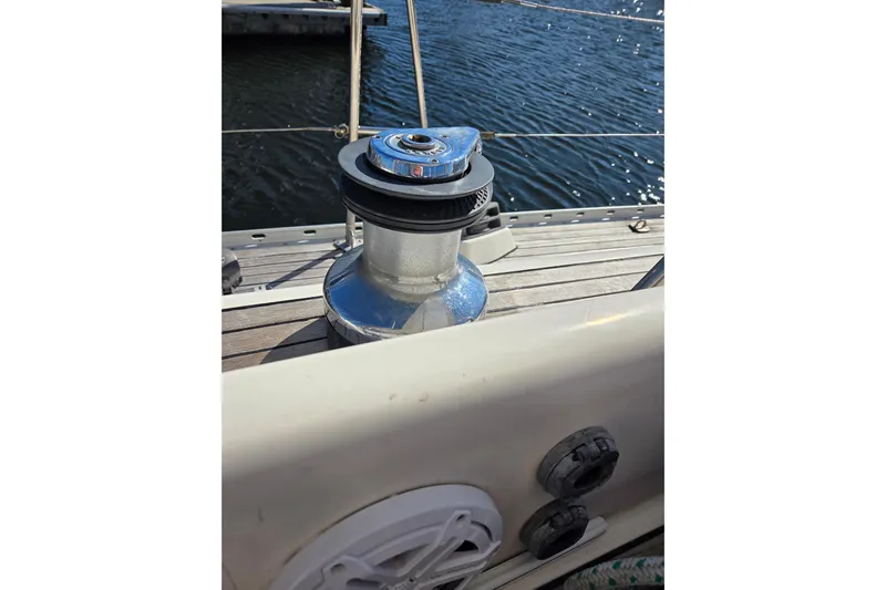 Pemaquid Yacht Photos Pics Winch on 1998 Oyster 485 Deck Saloon sailboat, docked by the water.