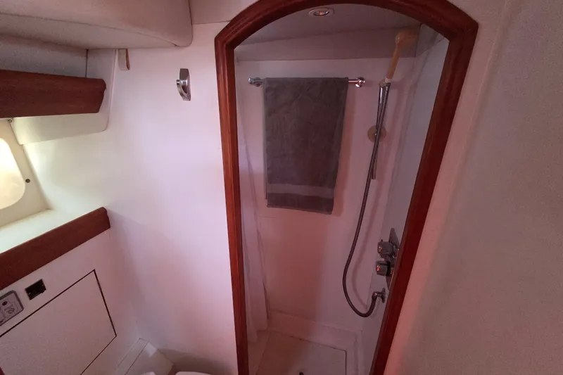 Pemaquid Yacht Photos Pics Bathroom interior of 1998 Oyster 485 Deck Saloon yacht with shower and towel.