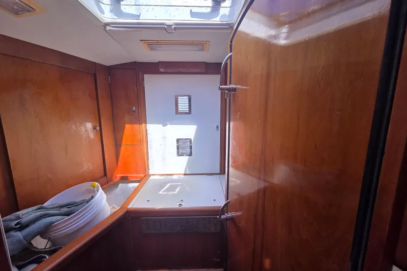 Pemaquid Yacht Photos Pics Interior of 1998 Oyster 485 Deck Saloon with wooden paneling and skylight.