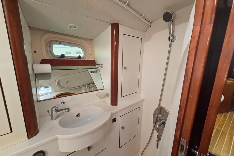 Pemaquid Yacht Photos Pics Bathroom interior of 1998 Oyster 485 Deck Saloon yacht with sink and shower.