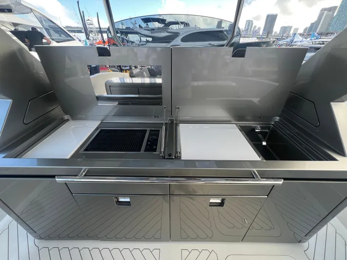  Yacht Photos Pics 2023 Canados 493 Gladiator yacht kitchen with sleek stainless steel design.