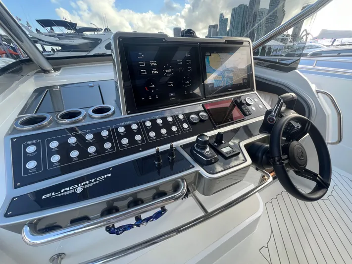  Yacht Photos Pics 2023 Canados 493 Gladiator helm with advanced navigation controls and digital displays.