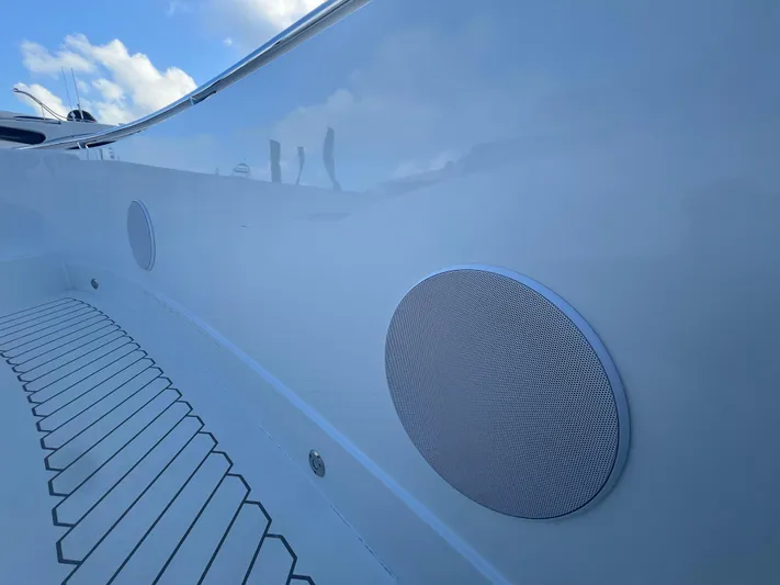  Yacht Photos Pics 2023 Canados 493 Gladiator yacht with sleek exterior and integrated speakers.