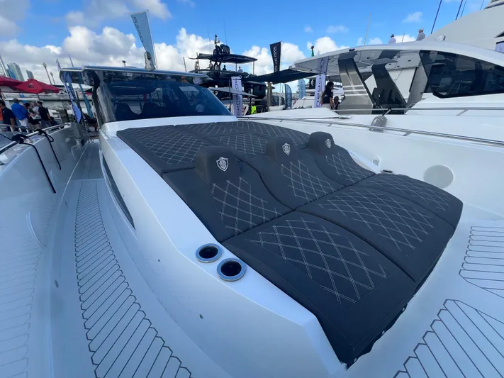  Yacht Photos Pics 2023 Canados 493 Gladiator luxury yacht with sleek design and comfortable seating.