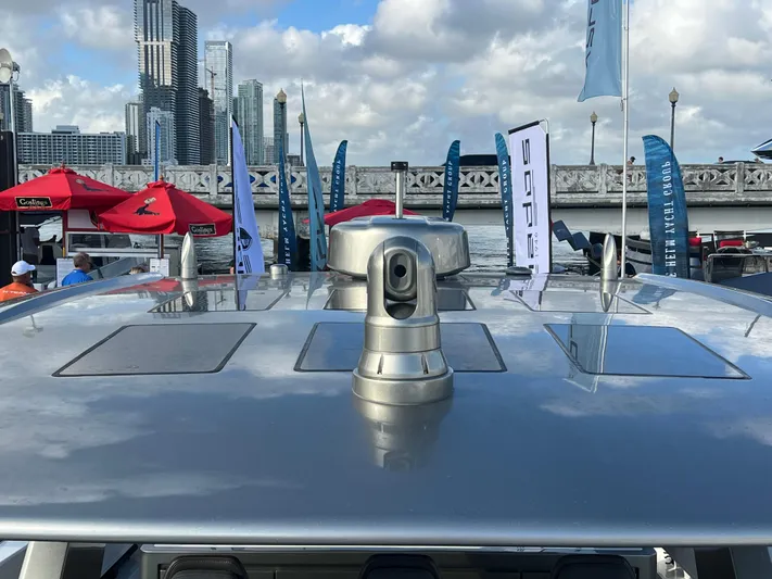  Yacht Photos Pics 2023 Canados 493 Gladiator yacht with city skyline and flags in the background.