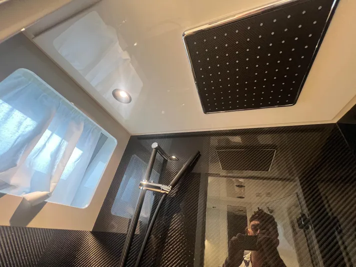  Yacht Photos Pics Luxury bathroom interior of 2023 Canados 493 Gladiator yacht with modern shower design.
