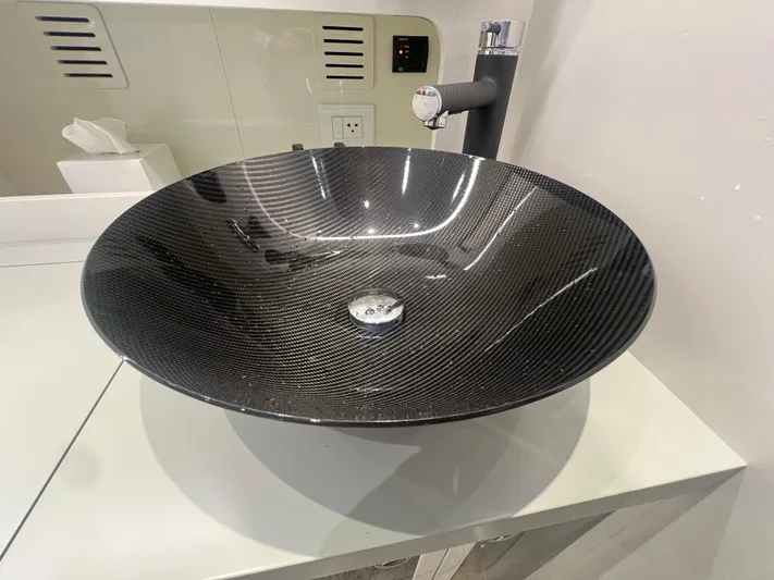  Yacht Photos Pics Carbon fiber sink in 2023 Canados 493 Gladiator yacht bathroom.