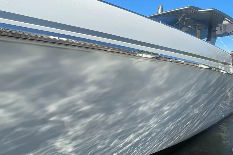  Yacht Photos Pics 2023 Canados 493 Gladiator yacht side view with water reflections.