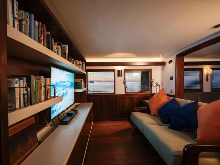 La Fenice Yacht Photos Pics Luxurious yacht interior with bookshelf and sofa, Laurent Giles 1962.