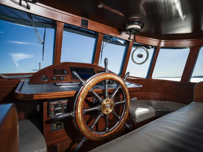 La Fenice Yacht Photos Pics Interior of a 1962 Laurent Giles yacht with wooden steering wheel.