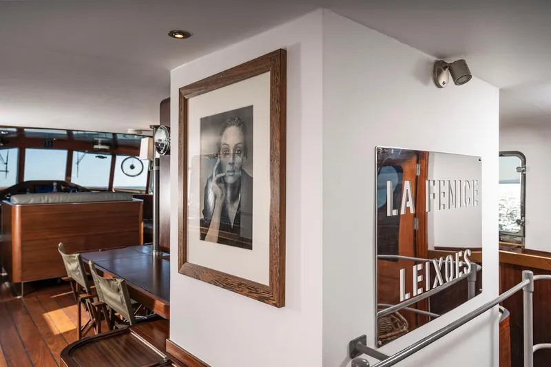 La Fenice Yacht Photos Pics Interior of a 1962 Laurent Giles yacht with artwork and wooden furnishings.