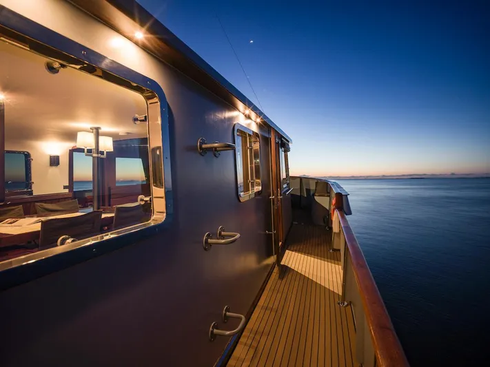 La Fenice Yacht Photos Pics Laurent Giles 1962 yacht at sunset on calm sea.