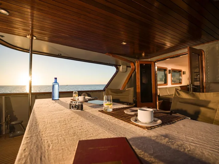 La Fenice Yacht Photos Pics Elegant interior of a 1962 Laurent Giles yacht at sunset.