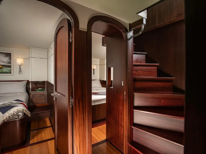 La Fenice Yacht Photos Pics Interior of a 1962 Laurent Giles yacht with wooden doors and staircase.