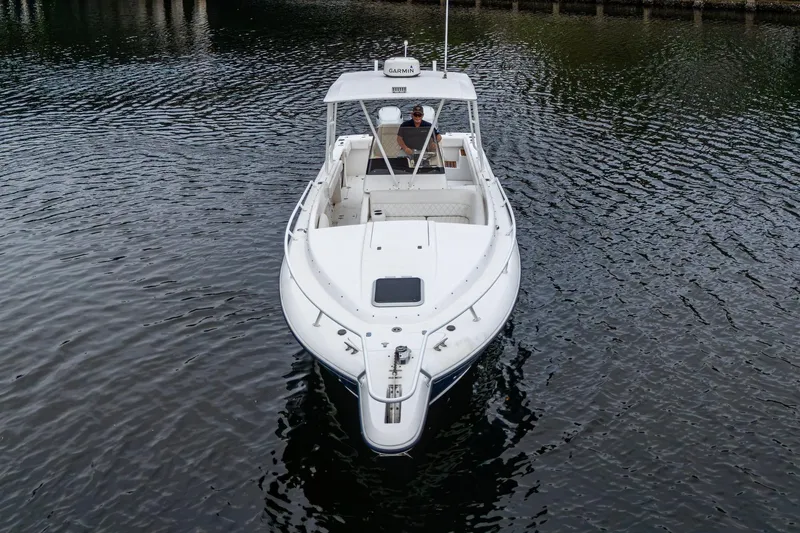  Yacht Photos Pics 2003 Intrepid 32 boat on calm water, aerial view.