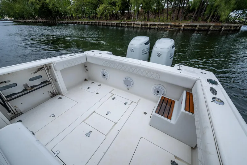  Yacht Photos Pics 2003 Intrepid 32 boat with spacious deck and dual outboard engines.