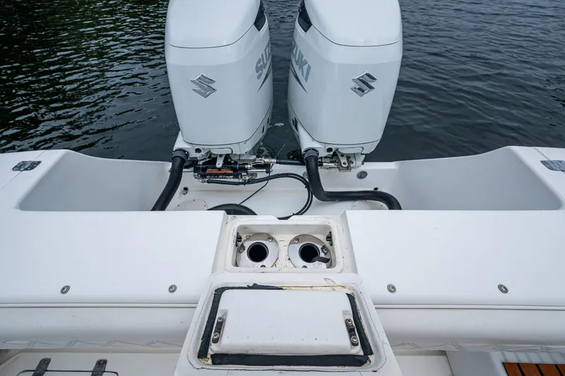  Yacht Photos Pics 2003 Intrepid 32 boat with dual Suzuki outboard engines on water.