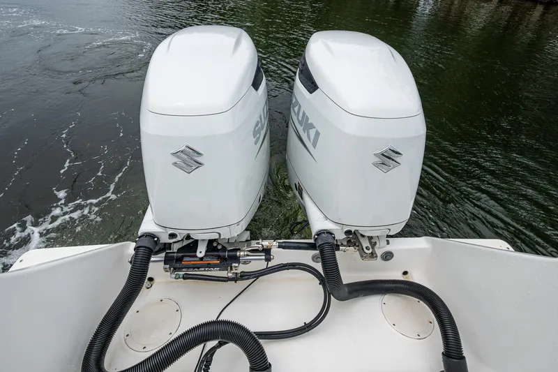  Yacht Photos Pics Twin Suzuki outboard motors on a 2003 Intrepid 32 boat, viewed from the stern.