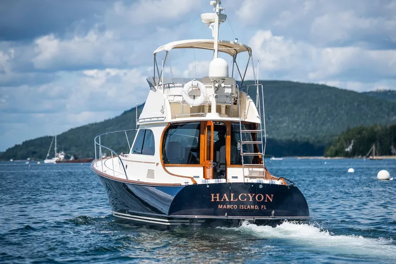 Halcyon Yacht Photos Pics 2006 Hinckley Talaria 44 FB yacht cruising on scenic waters.