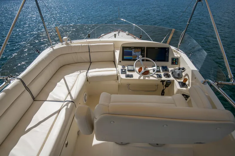 Halcyon Yacht Photos Pics 2006 Hinckley Talaria 44 FB yacht helm with luxurious seating and navigation controls.