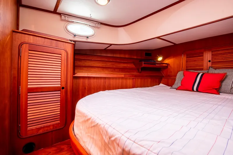 Halcyon Yacht Photos Pics Luxurious cabin interior of 2006 Hinckley Talaria 44 FB yacht with wooden finish.