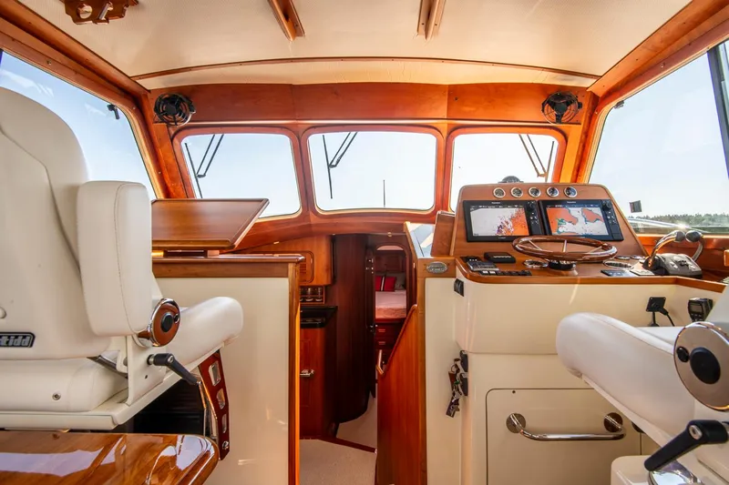 Halcyon Yacht Photos Pics 2006 Hinckley Talaria 44 FB yacht interior with navigation equipment and luxurious seating.