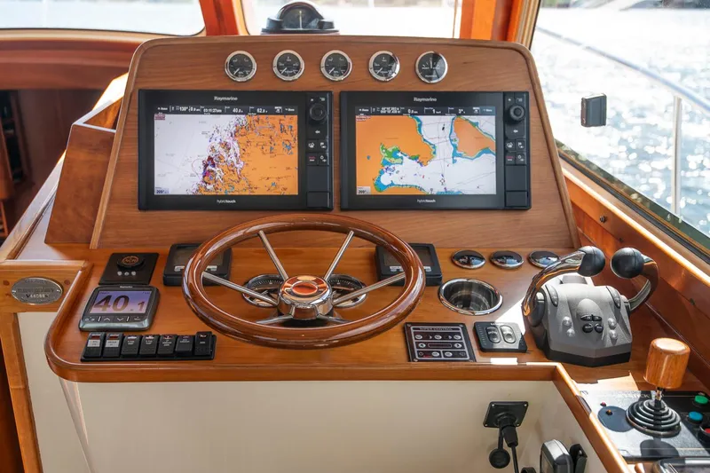 Halcyon Yacht Photos Pics Helm of 2006 Hinckley Talaria 44 FB with navigation screens and controls.