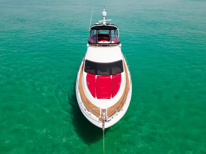  Yacht Photos Pics 2006 Sea Ray 44 Sedan Bridge yacht on clear turquoise water, aerial view.