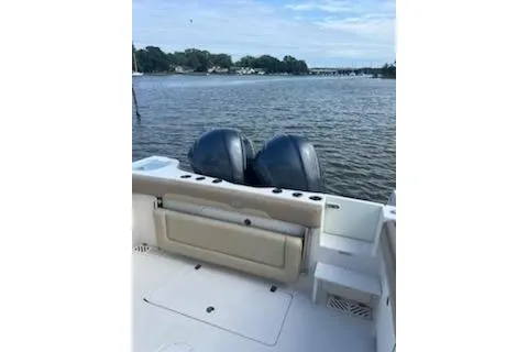  Yacht Photos Pics 2017 Sailfish 320 CC boat with dual engines on a calm lake.