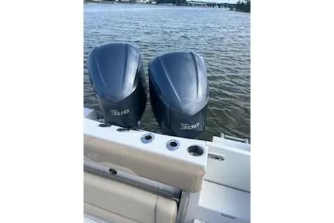  Yacht Photos Pics 2017 Sailfish 320 CC boat with twin 300 horsepower engines on water.