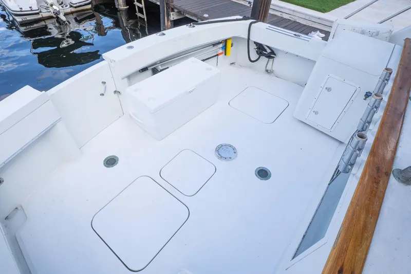 Masterplan Yacht Photos Pics 1975 Hatteras 58 YF yacht deck with storage compartments and rod holders.