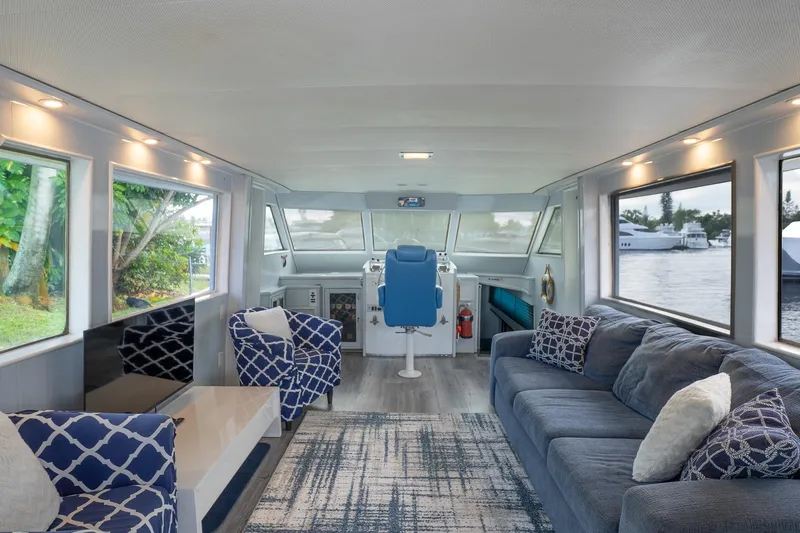 Masterplan Yacht Photos Pics Interior of 1975 Hatteras 58 YF yacht with modern seating and large windows.