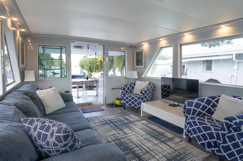 Masterplan Yacht Photos Pics Luxurious interior of a 1975 Hatteras 58 YF yacht with modern furnishings and large windows.