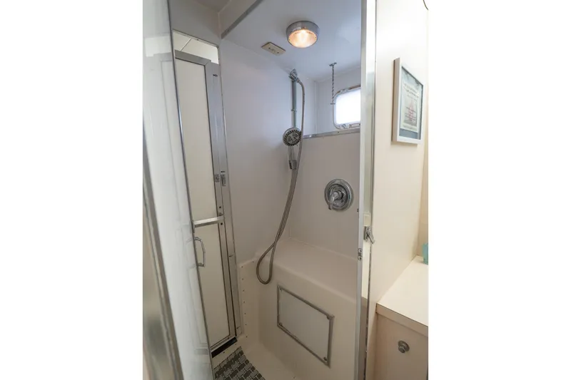 Masterplan Yacht Photos Pics Shower area in 1975 Hatteras 58 YF yacht, featuring modern fixtures and compact design.