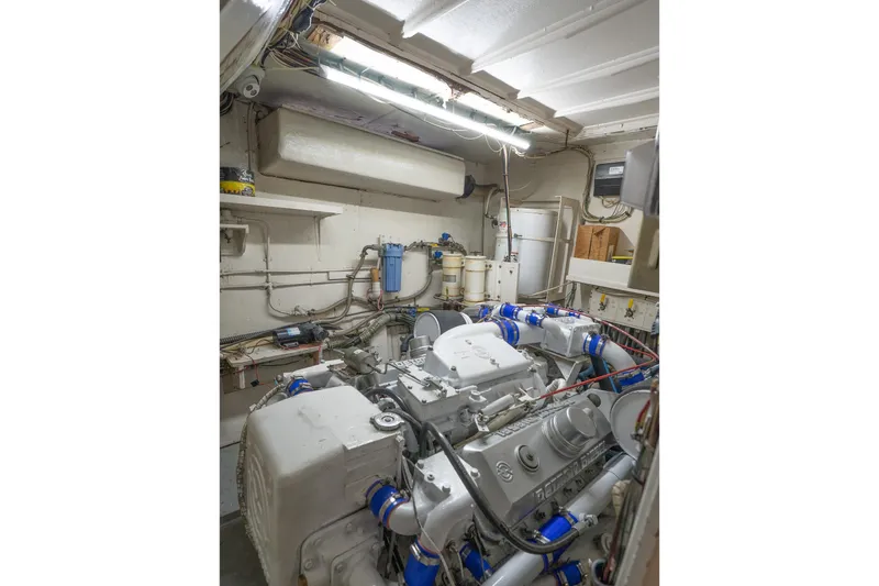 Masterplan Yacht Photos Pics Engine room of 1975 Hatteras 58 YF yacht with visible machinery and equipment.