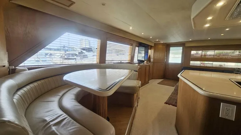  Yacht Photos Pics Interior of 1999 Hatteras 65 Convertible yacht with elegant seating and modern amenities.