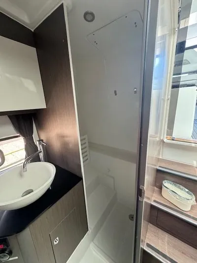 Fortuna Yacht Photos Pics 2022 Beneteau 32 Gran Turismo yacht bathroom with modern sink and shower.